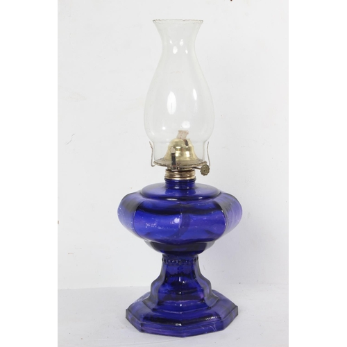 171 - A vintage blue glass oil lamp.