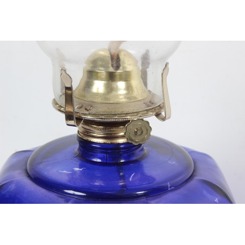 171 - A vintage blue glass oil lamp.