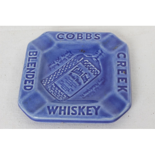 184 - A vintage Cobbs Whiskey ceramic ashtray.