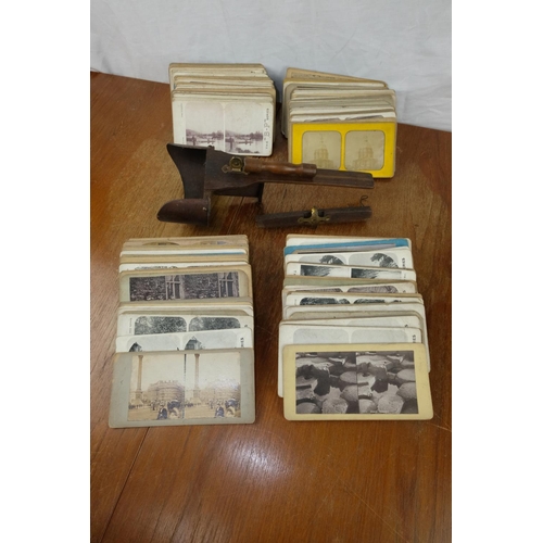 108 - A vintage wooden Stereoscope with approximately 175 viewing cards.