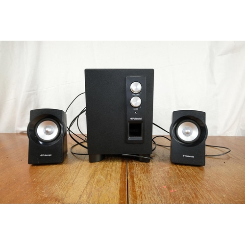 123 - Two Polariod computer speakers and base unit.