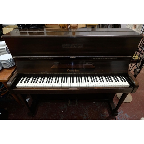 136 - A vintage Crane & Son mahogany cased piano. 114x135x56cm