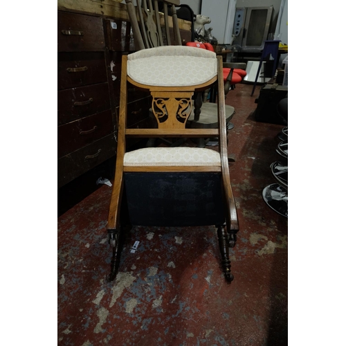 51 - An antique upholstered nursing chair with inlay detail to frame. 80cm