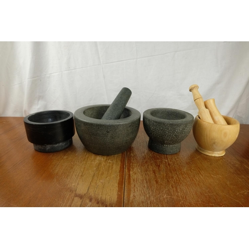 85 - A large granite pestle and mortar and more.