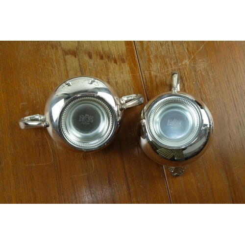 95 - A four piece Oneida silver plated tea service and two handled tray.