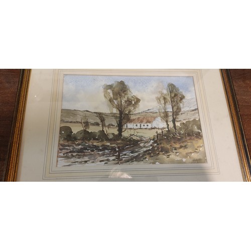 147 - A framed painting of a rural scene.