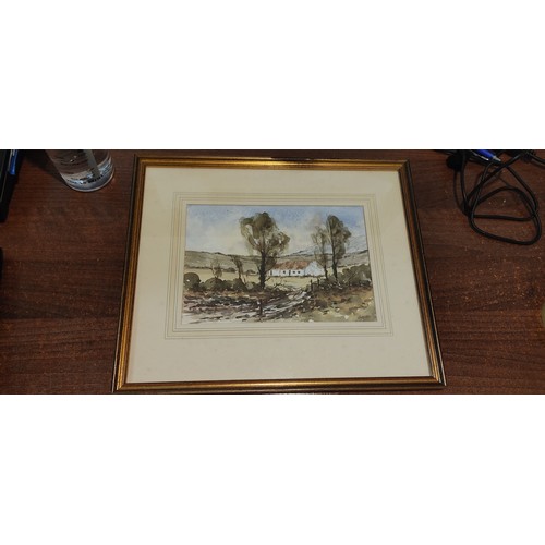 147 - A framed painting of a rural scene.