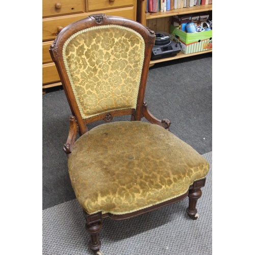 523 - An antique nursing chair. 89cm