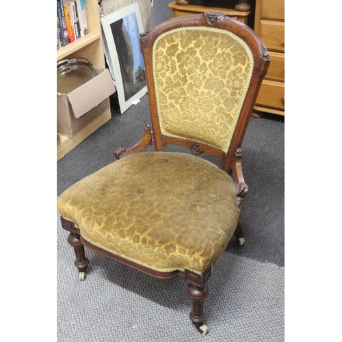 523 - An antique nursing chair. 89cm