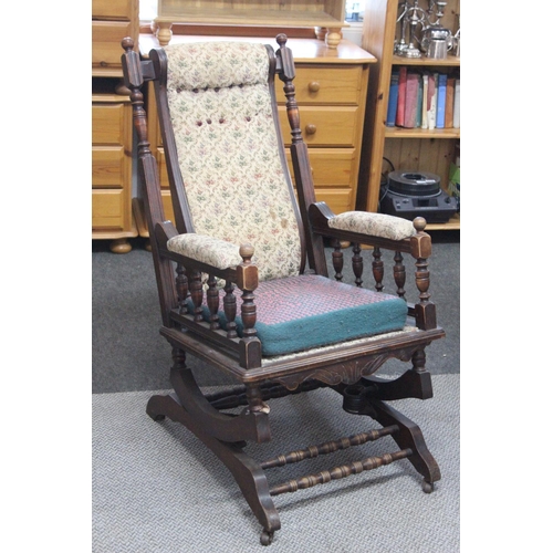 549 - An antique button-back rocking chair .