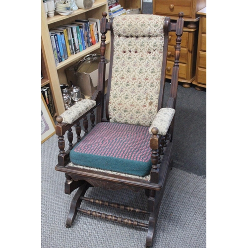 549 - An antique button-back rocking chair .