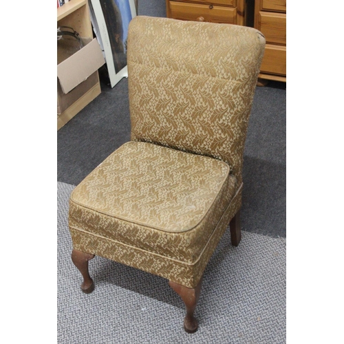 522 - A vintage nursing chair. 79cm