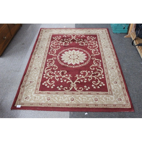 553 - A vintage Chatsworth rug. 169x120cm