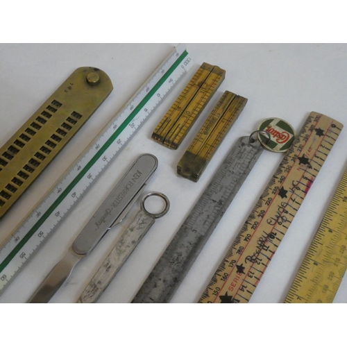 112 - A collection of various vintage rulers including a miniature Hockley Abbey wooden ruler, a Ken Forre... 