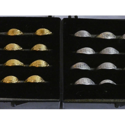 120 - Nine cases of silver and gold coloured metal rings.