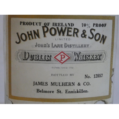 145 - A vintage John Power & Son Dublin whiskey bottle, bottled by John Mulhern & Co Belmore Street, Ennis... 