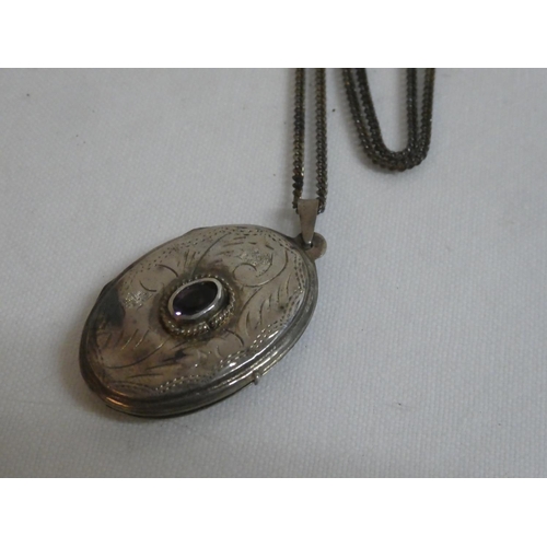 175 - A Sterling Silver locket and chain.