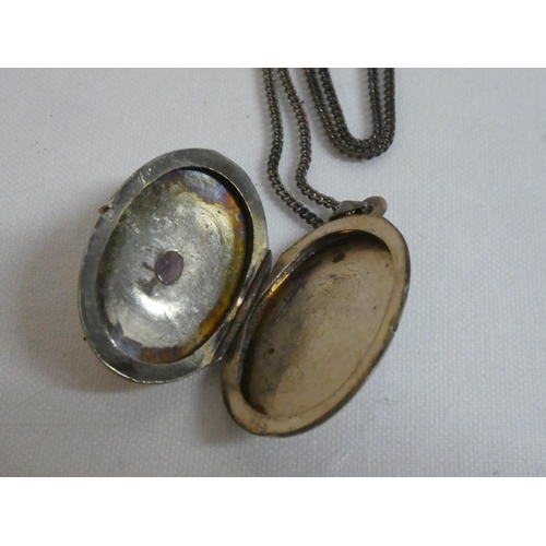 175 - A Sterling Silver locket and chain.