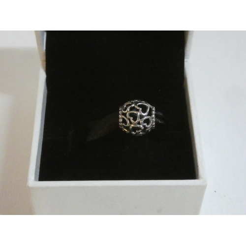 184 - A boxed Pandora charm.