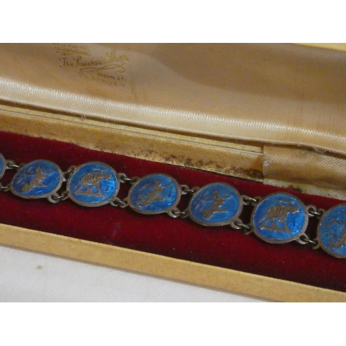 185 - An unusual metal and enamel bracelet.