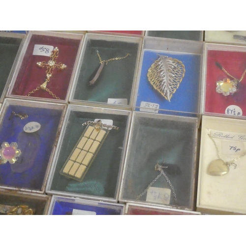 245 - A large lot of cased brooches and necklaces.