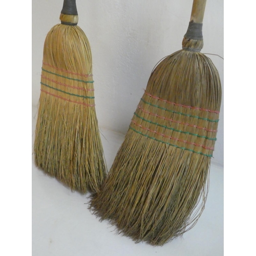 247 - Two vintage brooms.