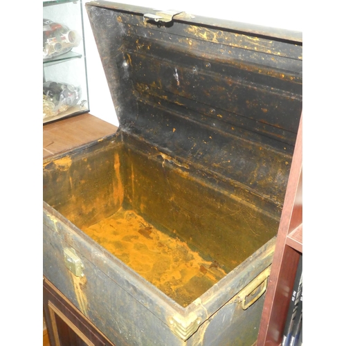 250 - An antique metal trunk.