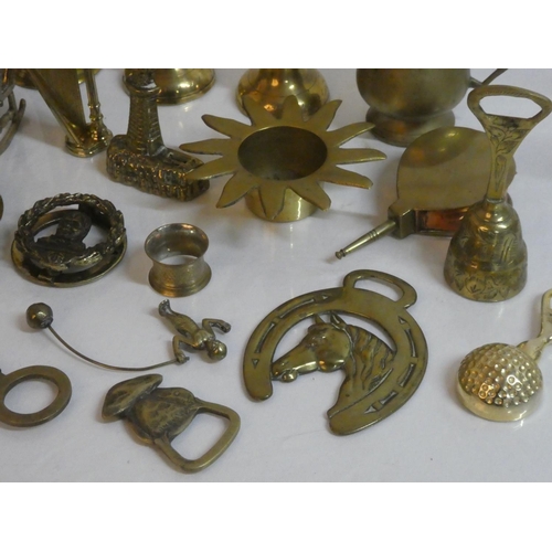 283 - A lot of assorted brass ware including a miniature scorpion table, horse brasses, harp and more.