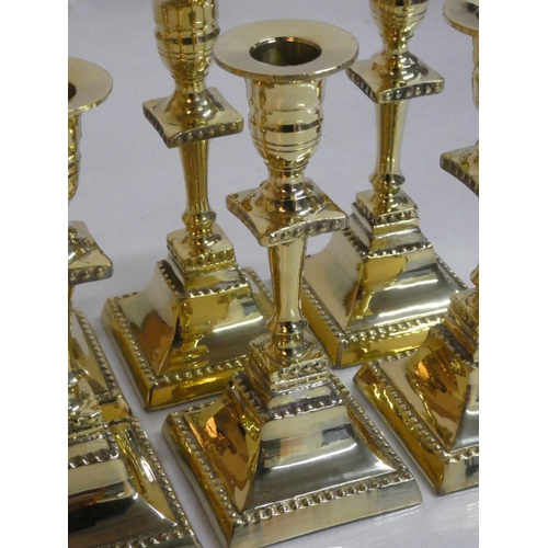 285 - Six brass candlesticks.