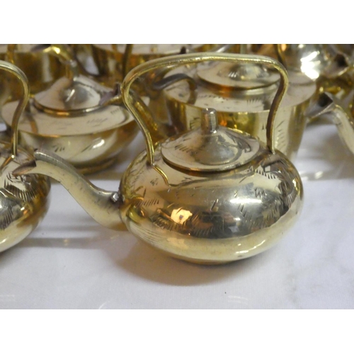 286 - A lot of miniature brass teapots.