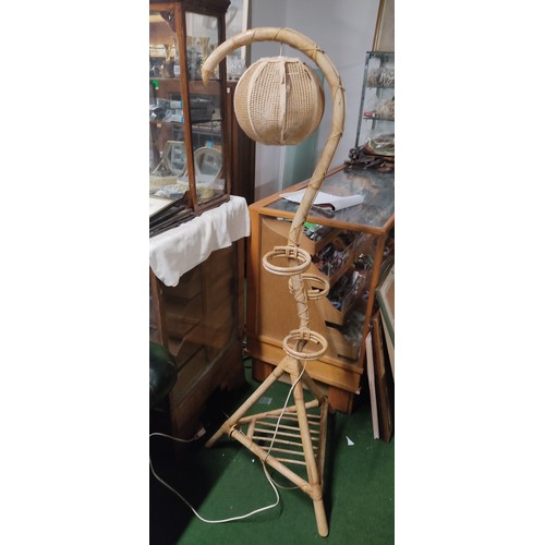 205 - A retro rattan standard lamp / plant stand.