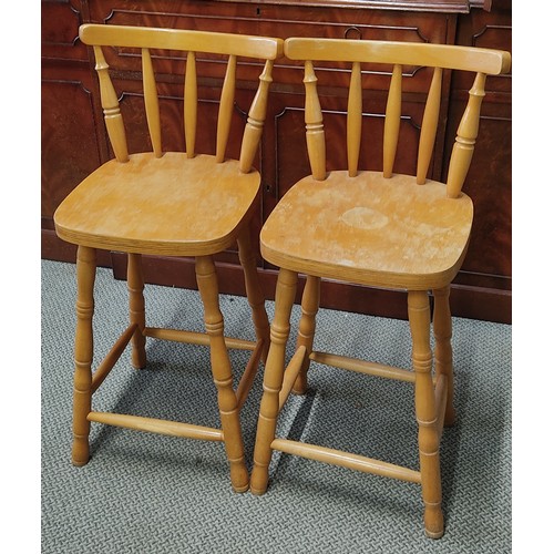 307 - A pair of pine bar stools.