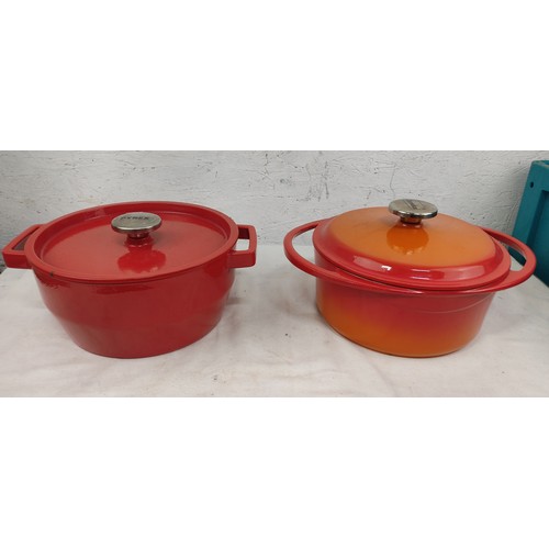 308 - A Berndex and Pyrex lidded cast iron enamel cooking pots.