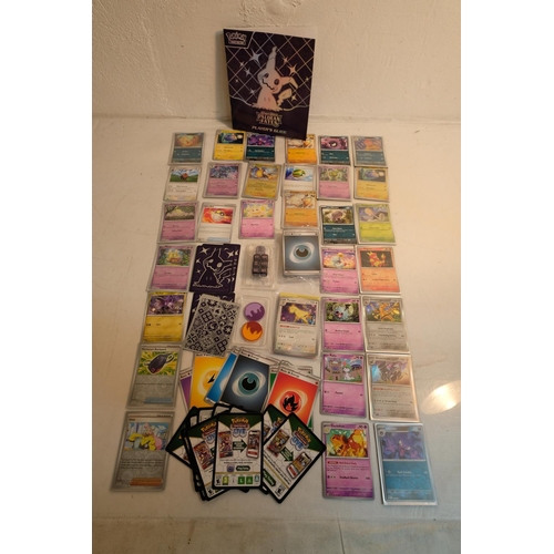 100 - A boxed Pokemon 'Scarlet & Violet' Paldean Fates elite trainer box and a large lot of collectors Pok... 