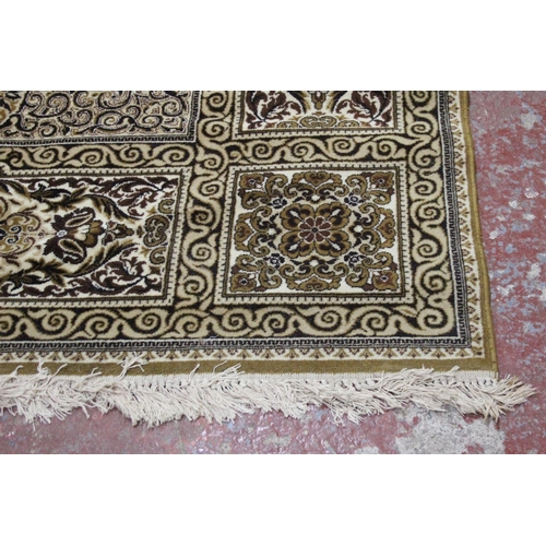 187 - A large patterned floor rug, measuring 410cm x 300cm.