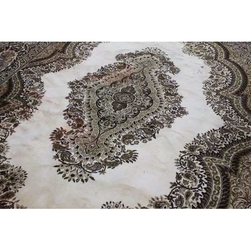 187 - A large patterned floor rug, measuring 410cm x 300cm.