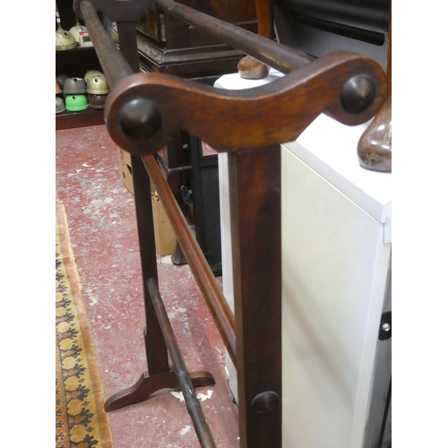 194 - A large antique mahogany towel rail, measuring 102cm.