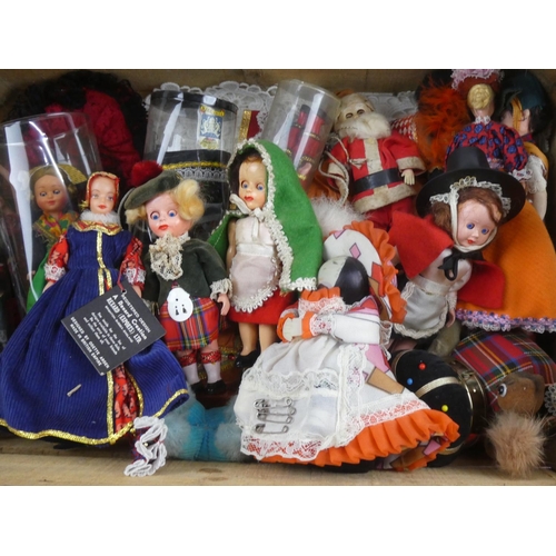 244 - A collection of vintage souvenir dolls.