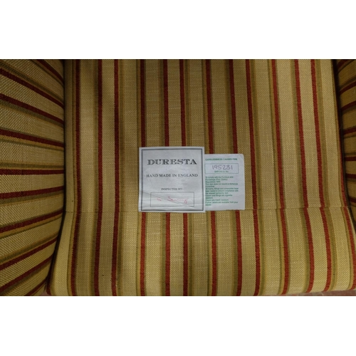 259 - A Duresta lounge chair with stripped pattern upholstery, in excellent order.