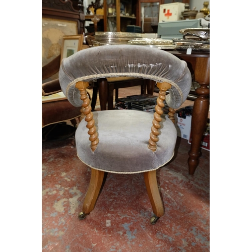 269 - A stunning antique/ Victorian library armchair with turned supports, measuring 76cm.