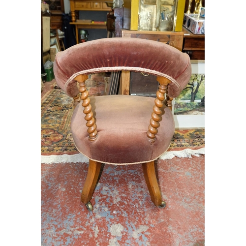 272 - A stunning antique/ Victorian library armchair with turned supports, measuring 76cm.