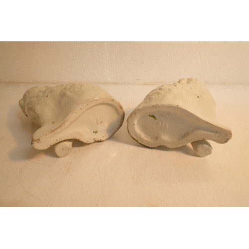 309 - A pair of antique style mantle dogs. Measuring 23cm