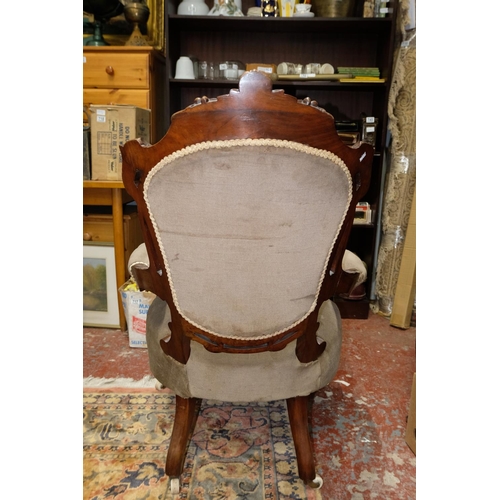 318 - A stunning antique mahogany deep buttoned back chair. Measuring 104cm