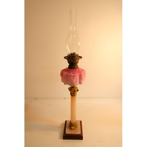 329 - A stunning antique oil lamp with a decorative pink font with bird design, marble and wood base. Meas... 