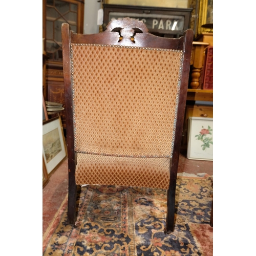 73 - An upholstered fireside chair, measuring 92cm.