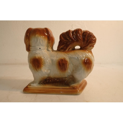 88 - An antique style Staffordshire dog, measuring 19cm.