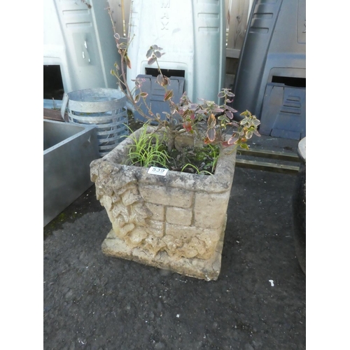 539 - A square concrete planter.