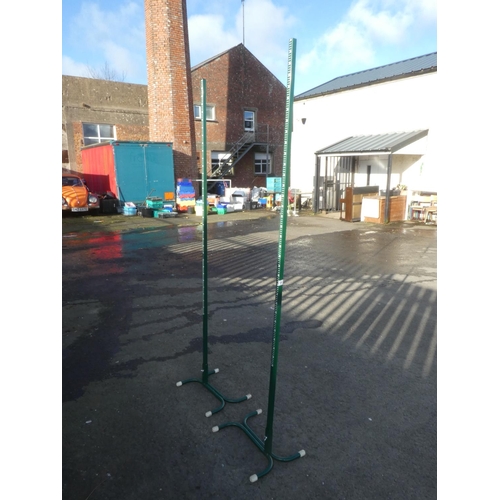 547 - A pair of badminton net stands.