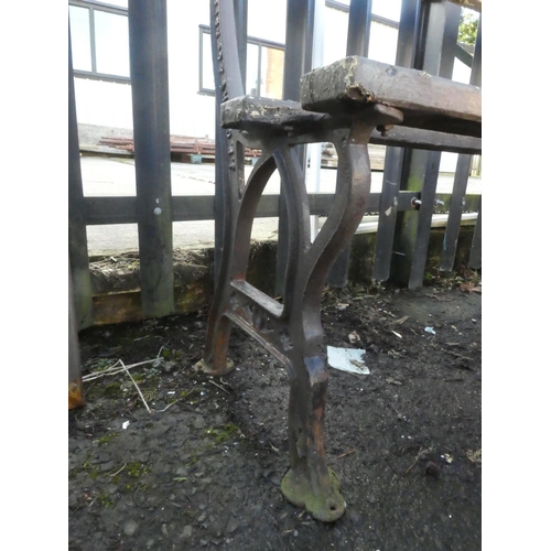 548 - A garden bench with cast iron J P Corry & Co - Belfast ends.