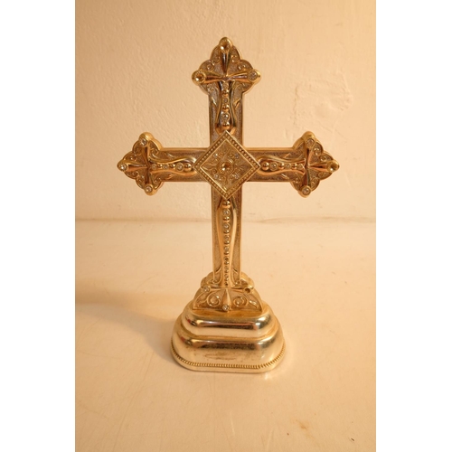 353 - A decorative metal crucifix, measuring 27cm.